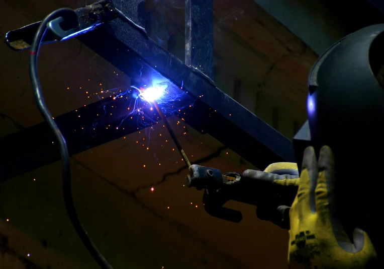 a welder working on a piece of metal, pexels contest winner, arbeitsrat für kunst, black steel buildings, avatar image, rectangle, (night)