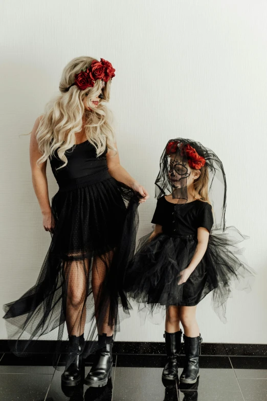 a woman in a black dress and a little girl in a black dress, thorn rose crown, tutu, or black, katelynn mini cute style