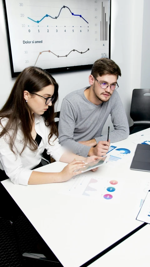 a group of people sitting around a white table, behance.net, low quality photo, russian academic, charts