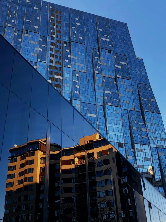 a very tall building sitting in the middle of a city, blue reflections, melbourne, thumbnail, megabuildings