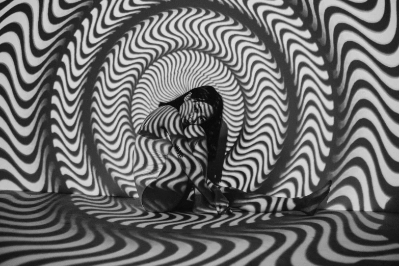 a black and white photo of a person riding a skateboard, a black and white photo, by Victor Vasarely, tumblr, optical illusion, swirly body painting, stood in a tunnel, psychedelic waves, 3 6 0 projection