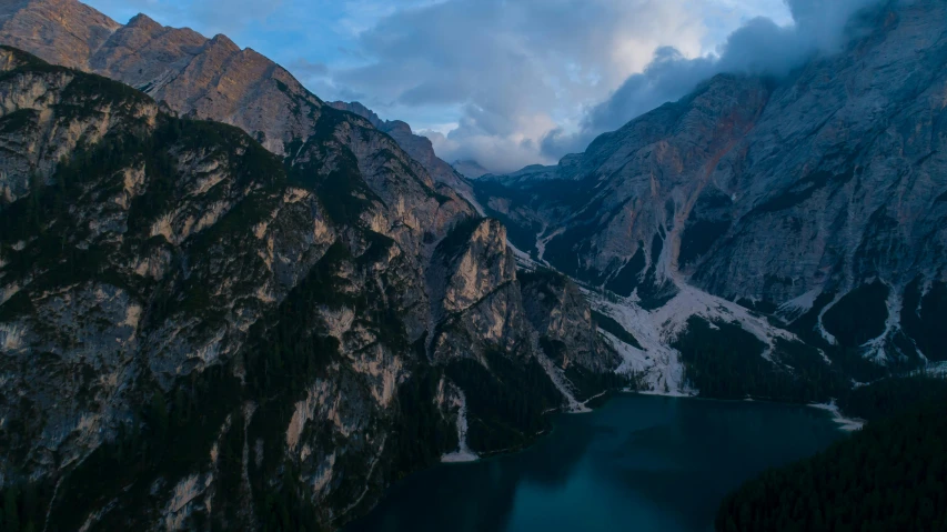 a large body of water surrounded by mountains, by Sebastian Spreng, pexels contest winner, hurufiyya, early evening, aerial footage, italy, fan favorite