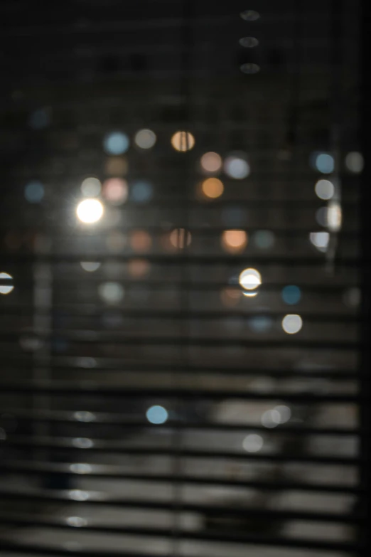 a cup of coffee sitting on top of a table next to a window, inspired by Andreas Gursky, light and space, bokeh!!!!, reflecting light in a nightclub, soft light through blinds, bokeh. i