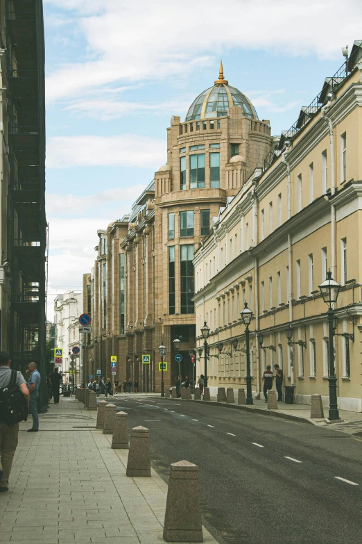 a group of people walking down a street next to tall buildings, inspired by Illarion Pryanishnikov, renaissance, on a great neoclassical square, seen from outside, gorgeous buildings, single street