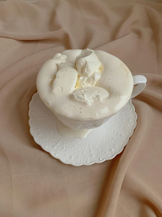 a cup of ice cream sitting on top of a white plate, carved marble texture silk cloth, cold as ice! 🧊, thumbnail, pale ivory skin