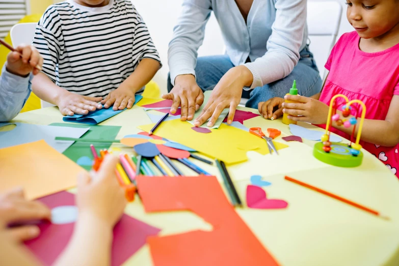 a group of children sitting around a table making crafts, a child's drawing, trending on pexels, process art, paper decoration, thumbnail, medium close up shot, fan favorite