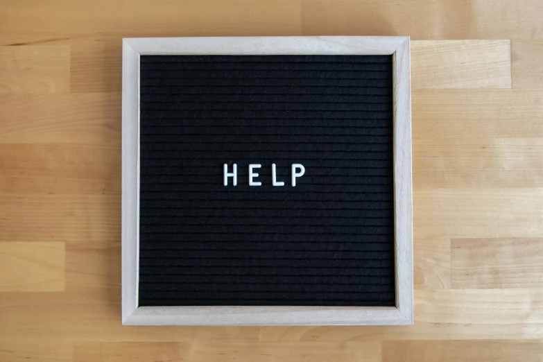 a black letter board sitting on top of a wooden floor, by Francis Helps, help, mint, 3 4 5 3 1, 3 2 x 3 2