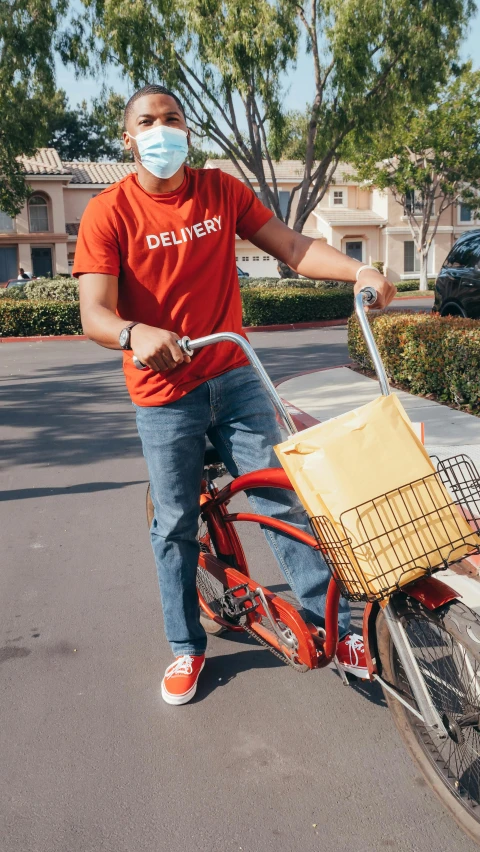 a man riding a bike with a basket on the back, by Robbie Trevino, pexels, graphic tees, official screenshot, in style of davey adesida, college