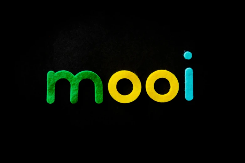 a close up of the word mooi on a black background, by Mór Than, reddit, animal crossing character, made of glowing wax, joan miro and moebius, mobile learning app prototype