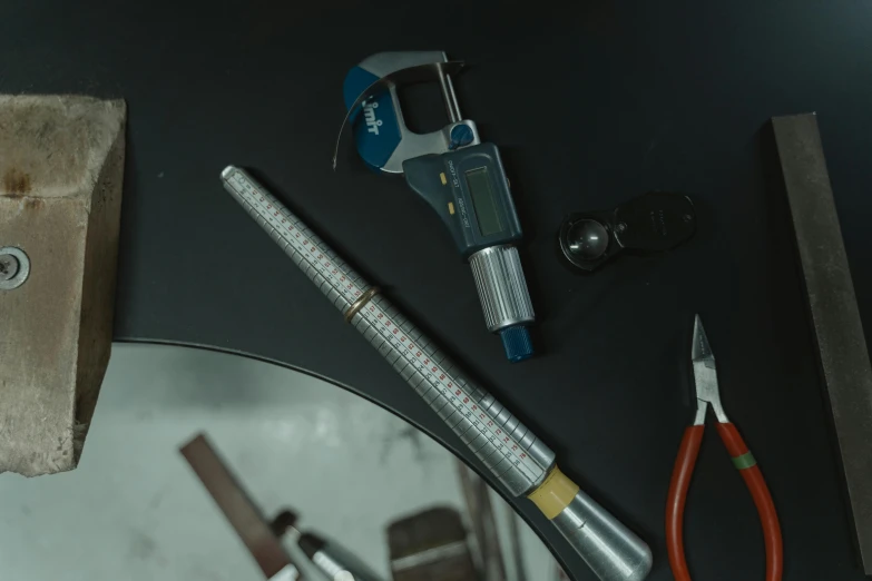 a group of tools sitting on top of a table, hyperrealistic movie filmstill, holding syringe, industrial design, curvy build