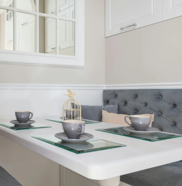 a table that has some cups and saucers on it, luxury bespoke kitchen design, light beige pillows, profile image, white and grey