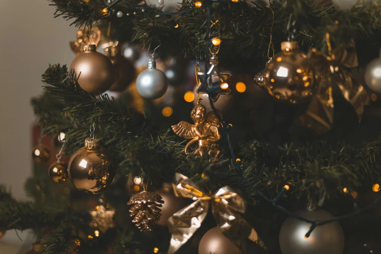 a close up of a christmas tree with ornaments, by Emma Andijewska, pexels, baroque, brown and gold, various posed, view, glistering