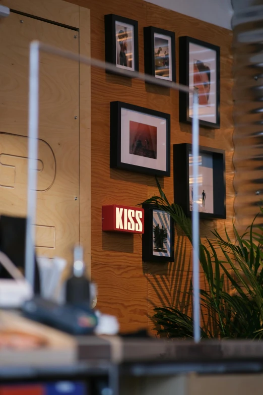 a laptop computer sitting on top of a desk, poster art, inspired by Elsa Bleda, unsplash, kiss, signboards, 8k 50mm iso 10, reylo kissing