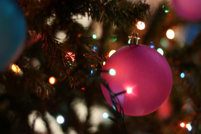 a pink ornament hanging from a christmas tree, pexels, happening, rim lights purple and green, thumbnail, shot on sony a 7, blank