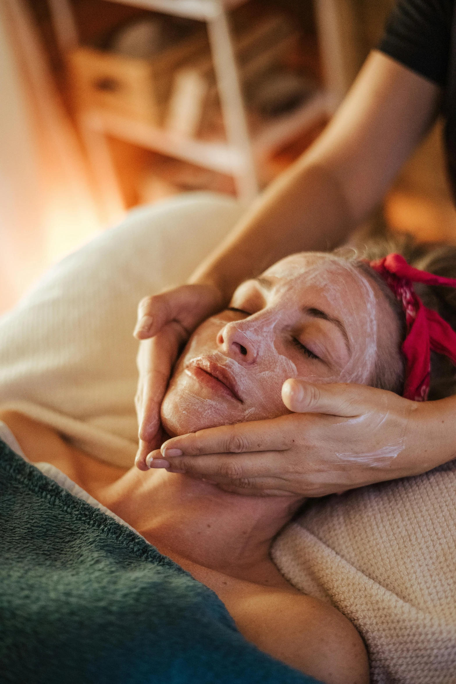 a woman getting a facial mask at a spa, by Julia Pishtar, pexels contest winner, renaissance, warm light, manuka, cardboard, lynn skordal