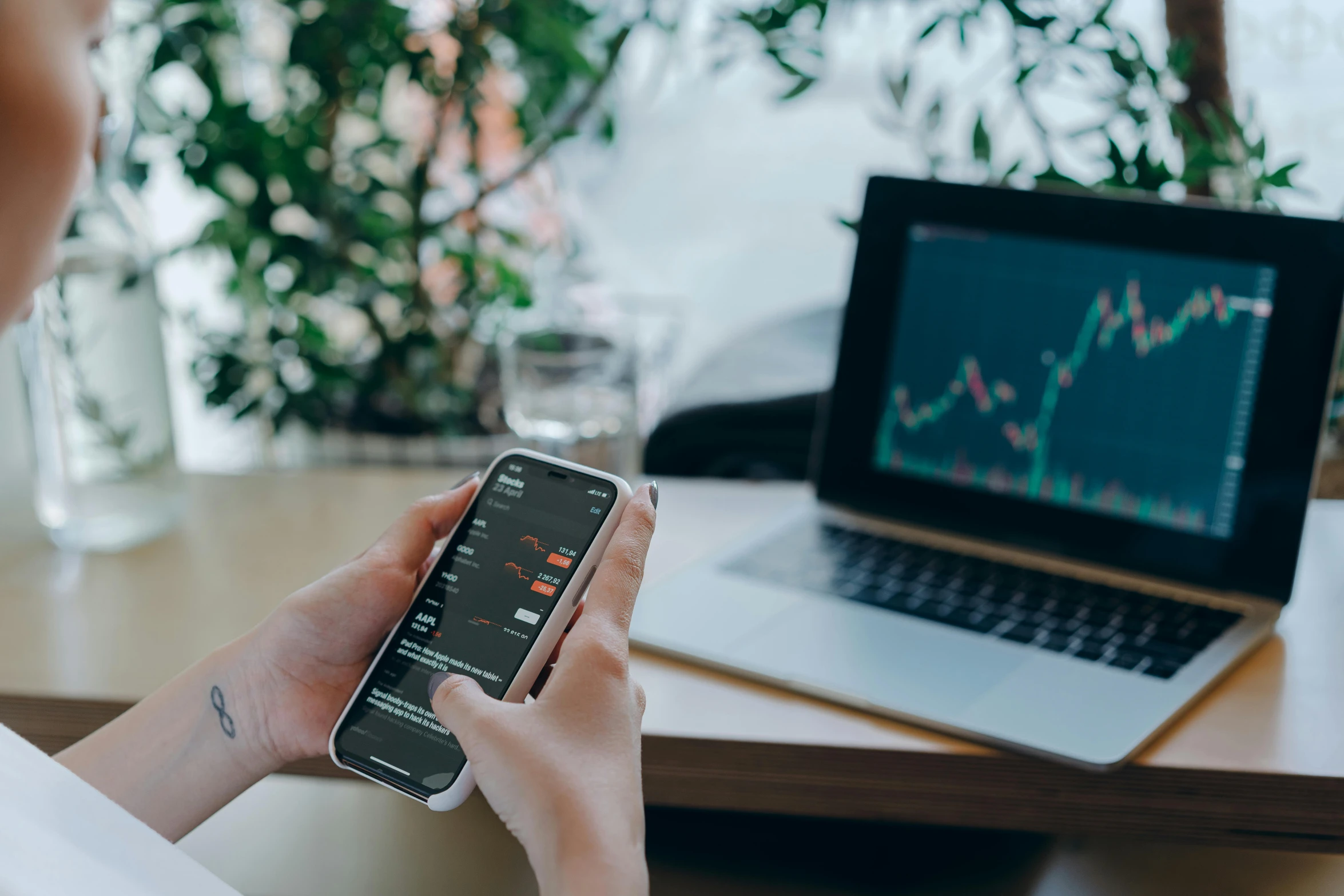 a person holding a cell phone in front of a laptop, a picture, trending on pexels, renaissance, trading stocks, avatar image, square, wētā fx