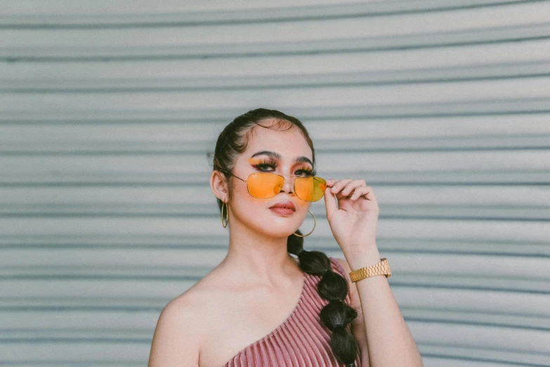 a woman with orange slices on her face, an album cover, inspired by Yang J, trending on pexels, yellow carrera glasses, casual pose, portrait of modern darna, snapchat photo