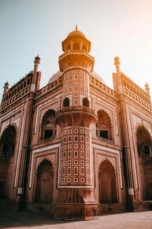 a large building sitting in the middle of a street, a marble sculpture, inspired by Steve McCurry, trending on unsplash, renaissance, taj mahal, profile pic, background image, golden hour intricate