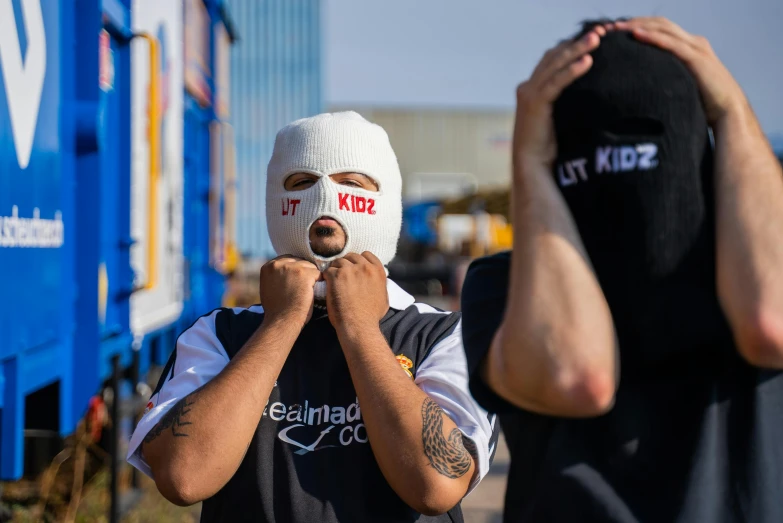 a man with a bandage on his face, by Adam Marczyński, reddit, graffiti, uniform off - white sky, balaclava, cute boys, bladee from drain gang