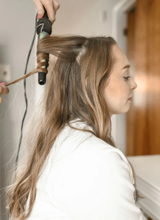 a woman blow drying another woman's hair, trending on pexels, renaissance, curled slightly at the ends, half - length photo, ready to model, gif