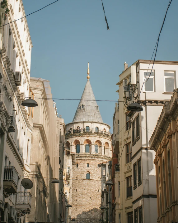 a narrow street with a clock tower in the background, pexels contest winner, art nouveau, ottoman sultan, thumbnail, neoclassical tower with dome, distant photo