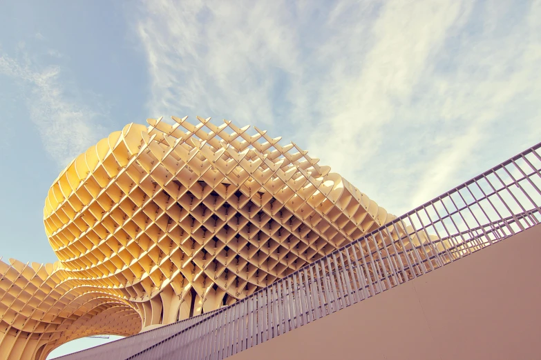 a large wooden structure on top of a building, inspired by Zha Shibiao, unsplash contest winner, seville, “ golden chalice, retro effect, parametric