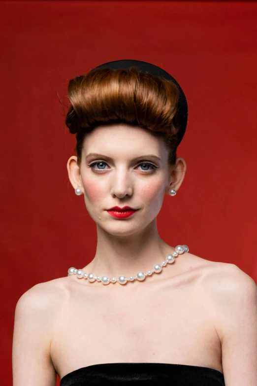 a woman in a black dress posing for a picture, a portrait, inspired by Viktor de Jeney, shutterstock contest winner, wearing pearl earrings, hairstyle red mohawk, smooth pale skin, full product shot