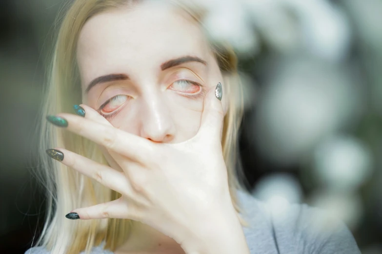 a close up of a person holding a cell phone to their face, inspired by Elsa Bleda, trending on pexels, hyperrealism, saoirse ronan, person made out of glass, black sclera white pupil, expressive pose