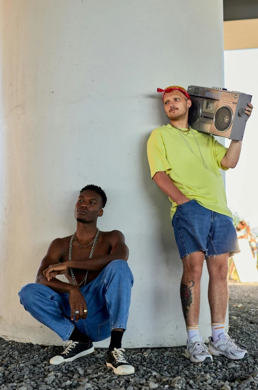 a couple of men standing next to each other, an album cover, unsplash, ghetto blaster, florida man, ( ( theatrical ) ), modeling shoot