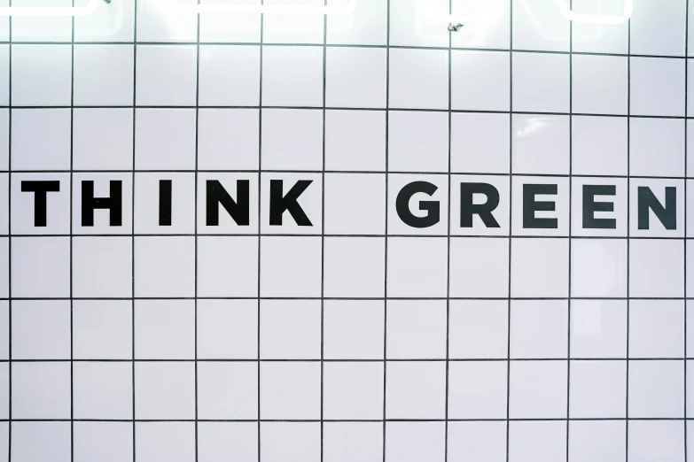 a sign that says think green on a tiled wall, by Art Green, trending on unsplash, black white pink, moscow metro, milk, flat grey