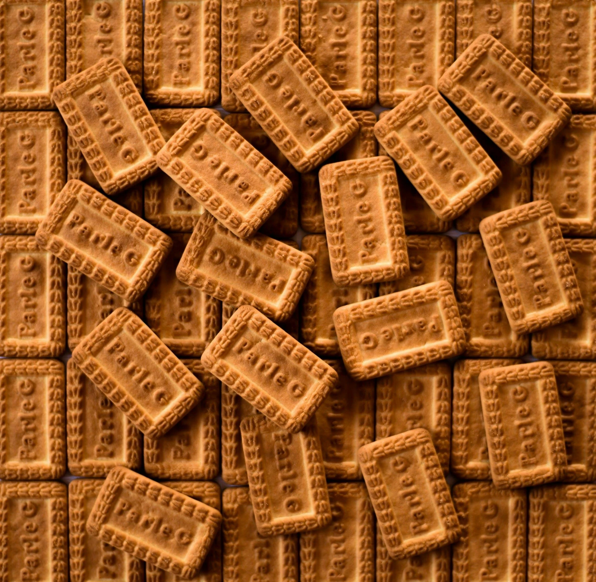 a pile of crackers sitting on top of a table, op art, caramel, embossed, shot with sony alpha, tetris