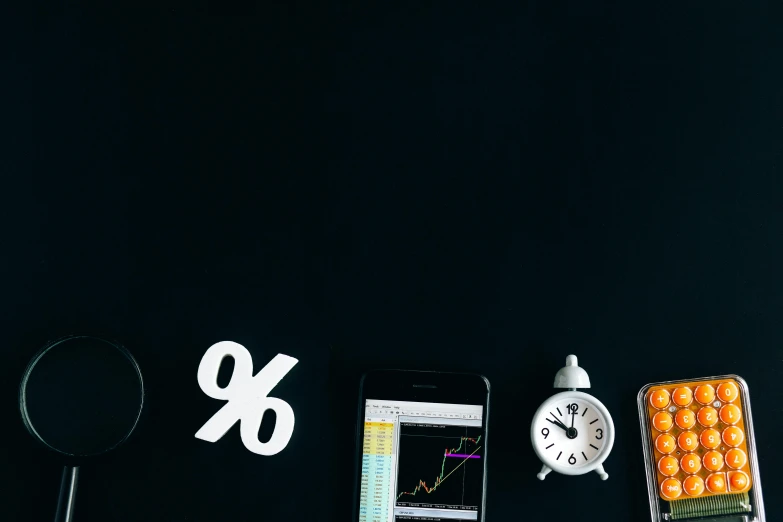 a cell phone sitting on top of a desk next to a clock, by Adam Marczyński, trending on unsplash, analytical art, currency symbols printed, blackboard, waveforms on top of square chart, thumbnail