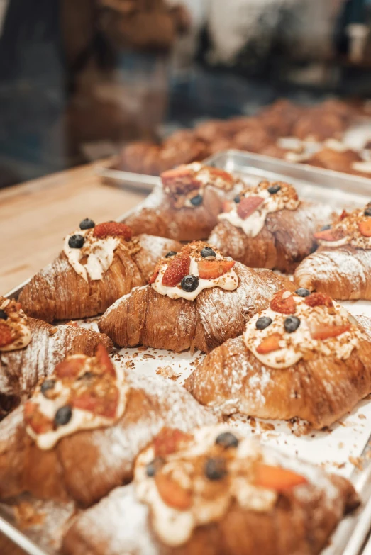 a close up of a tray of pastries on a table, profile image