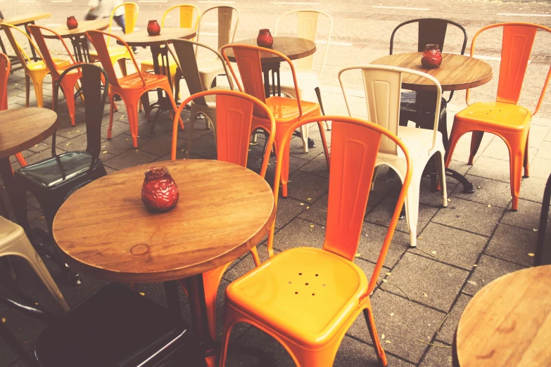 a number of tables and chairs near one another, by Romain brook, pexels, happening, orange yellow, instagram post, al fresco, retro stylised