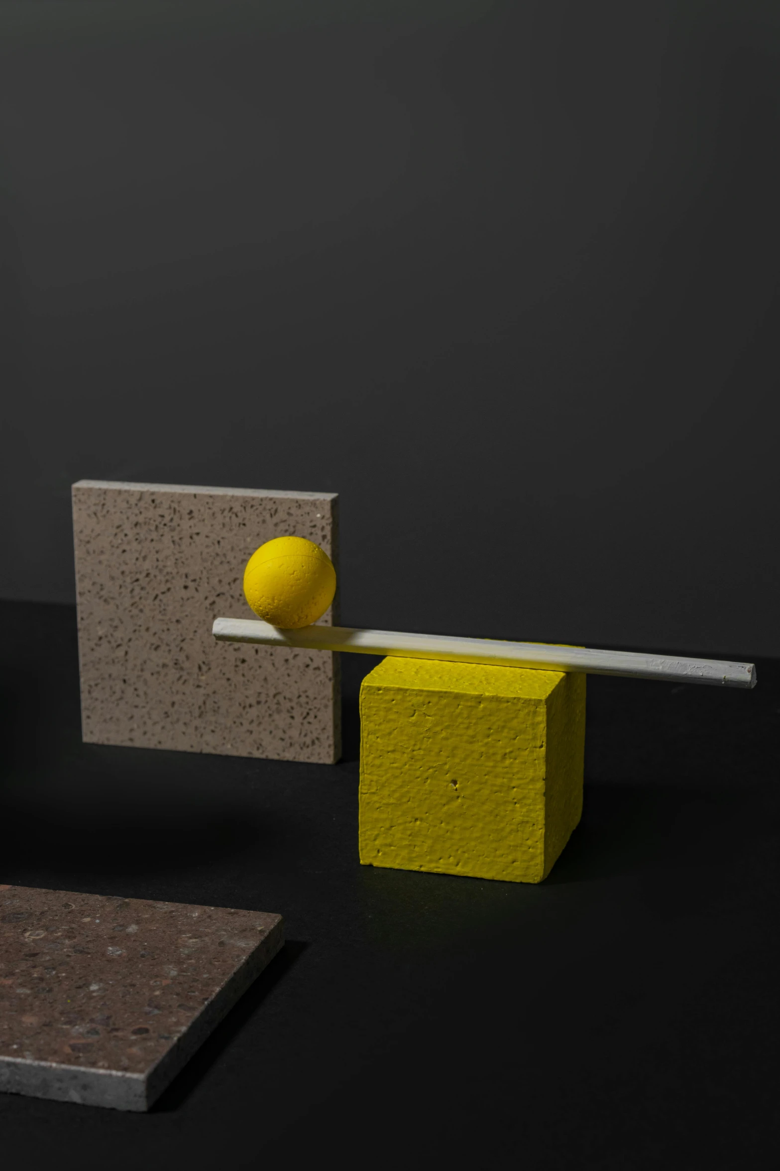 a group of objects sitting on top of a table, inspired by Bauhaus, yellow, balance, 3 d material, square