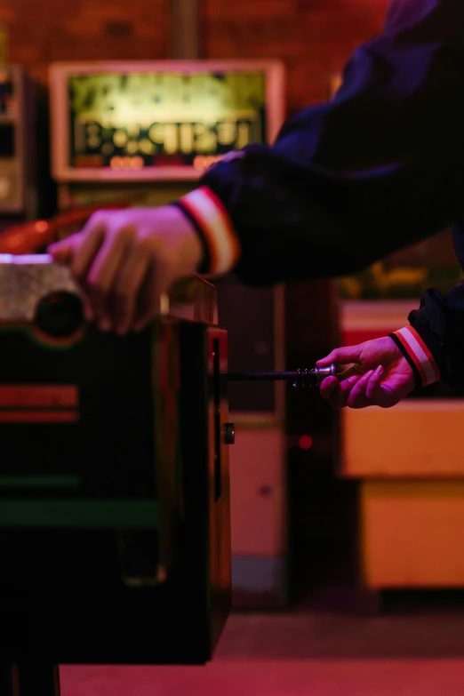 a man playing a game of foo foo foo foo foo foo foo foo foo foo foo foo, an album cover, unsplash, private press, dimly lit dive bar, holding a wrench, arcade cabinet, low detail