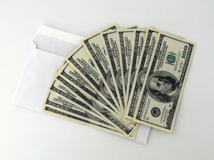 a bunch of money sitting on top of a white envelope, promo image, classified photo, fan favorite, garnishment
