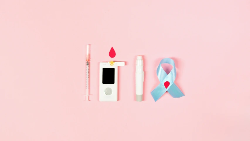 an ipod sitting on top of a pink surface next to a blue ribbon, a picture, by Évariste Vital Luminais, trending on pexels, antipodeans, blood collection vials, white ribbon, flat color, surgical iv drip