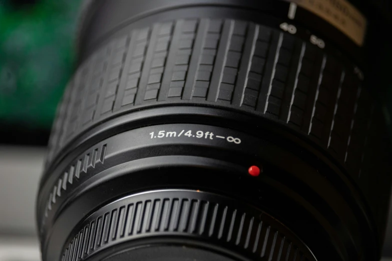 a camera lens sitting on top of a laptop computer, a macro photograph, by Adam Rex, unsplash, photorealism, high angle close up shot, f 1. 8 depth of field, medium close - up, depth of field 8k