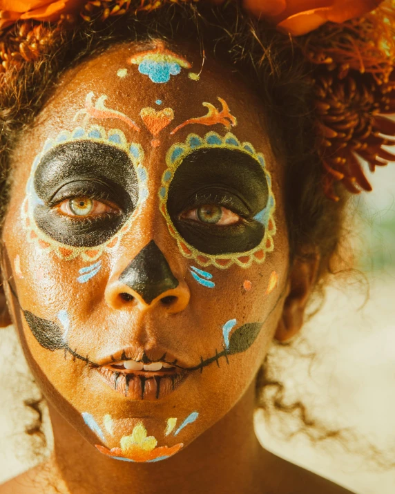 a close up of a person with a face paint, black arts movement, beautiful tan mexican woman, sacred skulls, lgbtq, madagascar