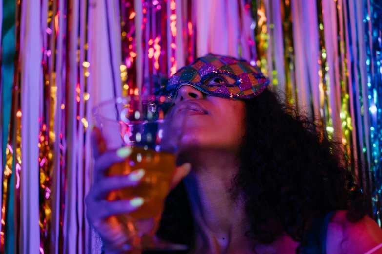 a woman holding a glass of wine in front of a curtain, trending on pexels, renaissance, neon face paint, blindfold, party lights, profile image