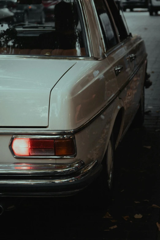 a white car parked on the side of the road, inspired by Elsa Bleda, pexels contest winner, tail lights, old style, profile picture, late 1 9 6 0's