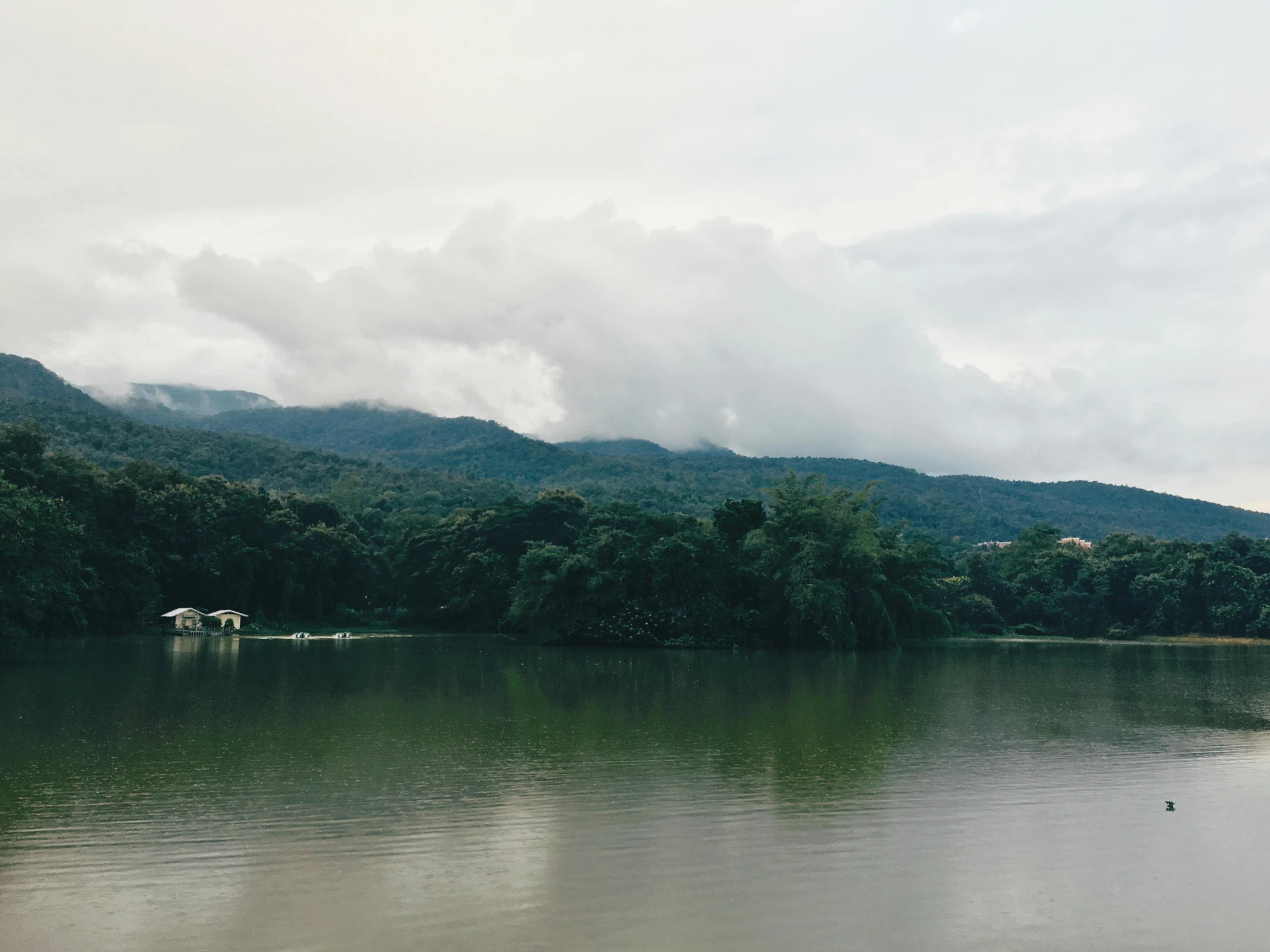 a body of water with mountains in the background, indian forest, trending on vsco, 2 0 0 0's photo, puerto rico