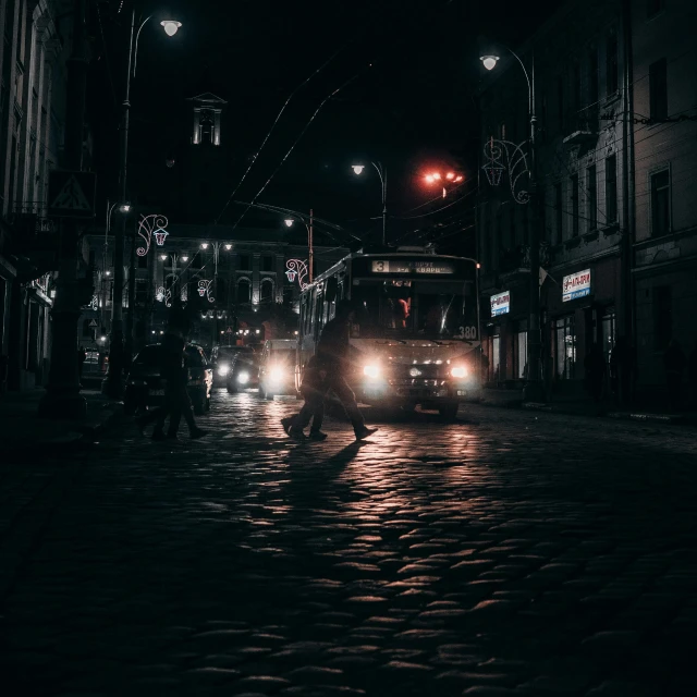 a fire truck driving down a street at night, by Adam Marczyński, pexels contest winner, dark figures walking, russian city, street tram, vintage photo