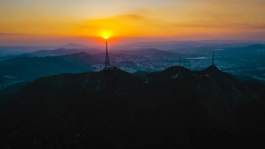 a view of a sunset from the top of a mountain, pexels contest winner, seoul, hollywood promotional image, lookout tower, aerial footage