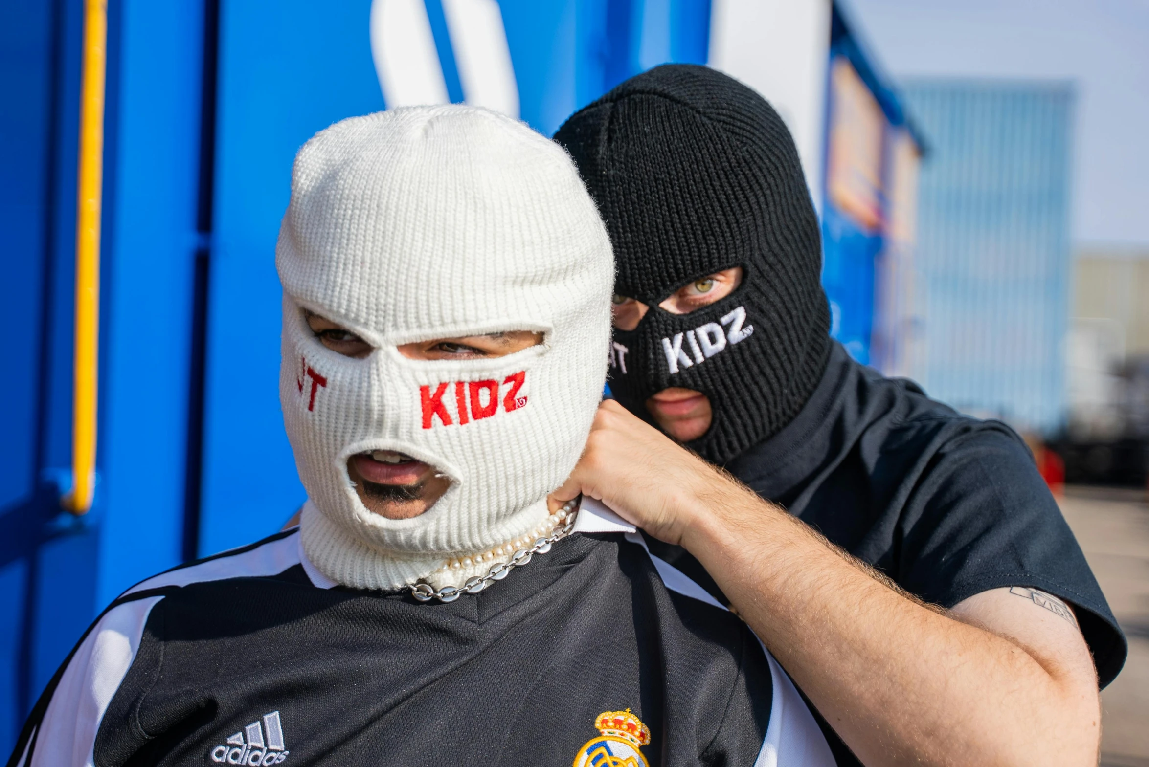 a couple of men standing next to each other, by Adam Marczyński, reddit, graffiti, ski masks, off - white collection, football hooligans, youtube thumbnail