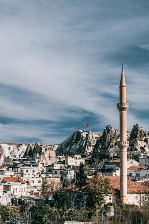 a tall tower sitting on top of a lush green hillside, a marble sculpture, trending on pexels, ottoman sultanate, spire, panoramic, 8 x