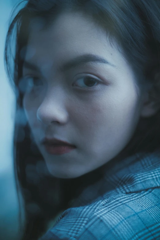 a close up of a person with long hair, inspired by Elsa Bleda, pexels contest winner, portrait of a japanese teen, blue gray, movie still frame, cold color