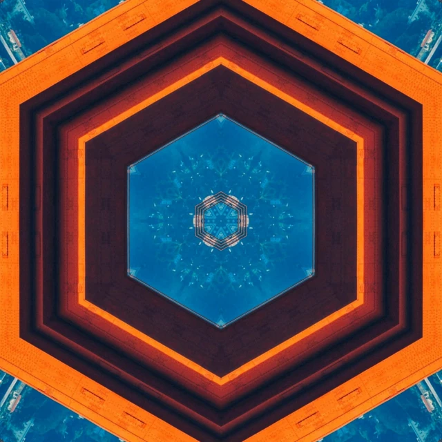 a picture of a blue and orange hexagon, an album cover, inspired by Lubin Baugin, unsplash, infinite fractal mandala tunnel, kaleidoscope of machine guns, instagram post, abstract mirrors