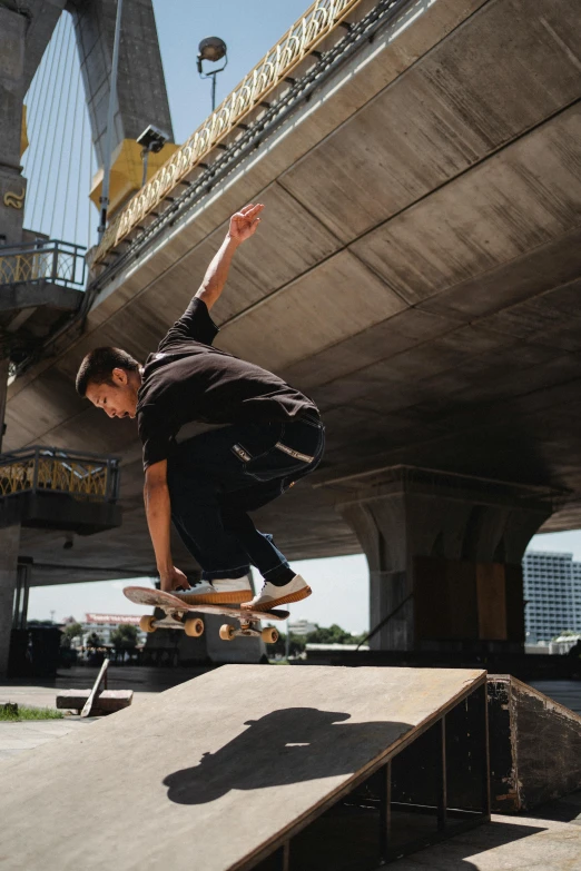 a man flying through the air while riding a skateboard, by Yosa Buson, unsplash, hyperrealism, bangkok, low quality photo, video footage, bridge